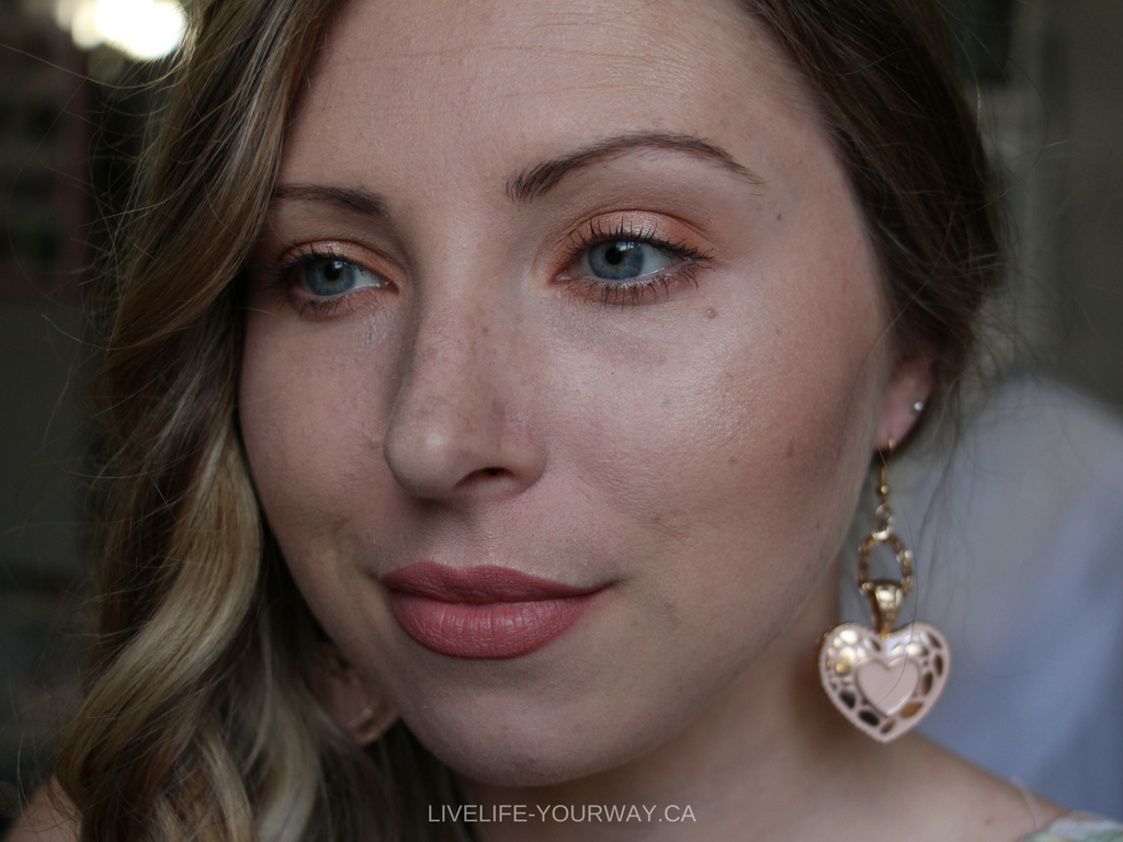 A pink nude lip compliments the peachy + gold tones in the makeup!
